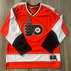 Mitchell Ness Bernie Parent Philadelphia Flyers Blue Line player hockey jersey.